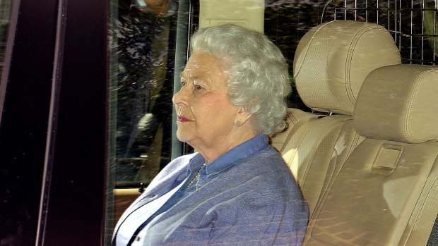 Proud great grandmother ... Britain's Queen Elizabeth II sits in the back seat of her vehicle after meeting her great granddaughter Princess Charlotte.