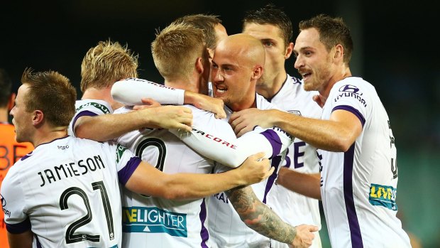 Perth Glory players celebrate a goal by Andrew Keogh in the A-League match against Sydney FC.