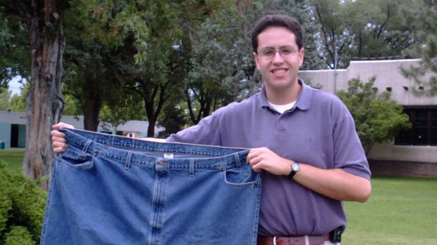 In this August 7, 2001 file photo, Jared Fogle holds up a pair of jeans he used to wear before losing weight.
