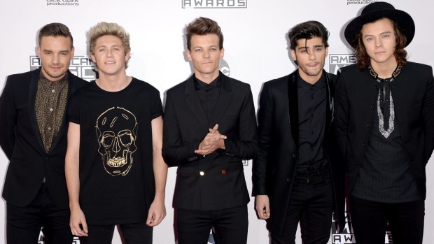 First One Direction baby on its way? Louis Tomlinson, centre, with former bandmate Zayn Malik, second right, and current bandmates, Liam Payne, left, Niall Horan and Harry Styles.