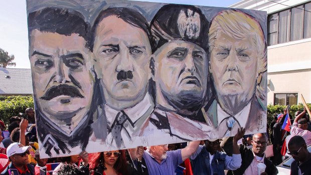 Jeff Flake likened Trump to Stalin, something the Haitian community also did on Monday during a protest outside Trump's Mar-a-Lago resort.