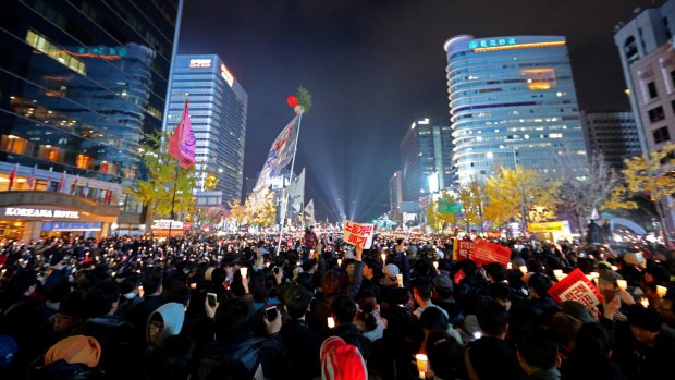 Thousands of South Koreans take to the streets in the city center to demand President Park Geun-Hye to step down.
