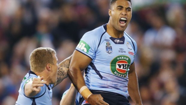 Lucky escape:  Michael Jennings celebrates scoring his try during game two of the Origin series.