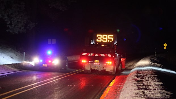 Highway 395 is blocked at Seneca between John Day and Burns, Oregon, by state police officers on Tuesday evening.