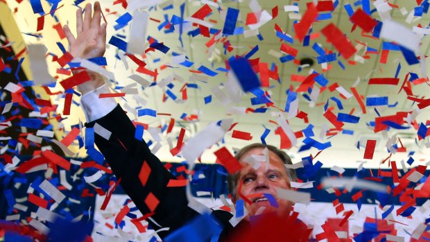 Democrat Doug Jones waves to supporters following his stunning victory.