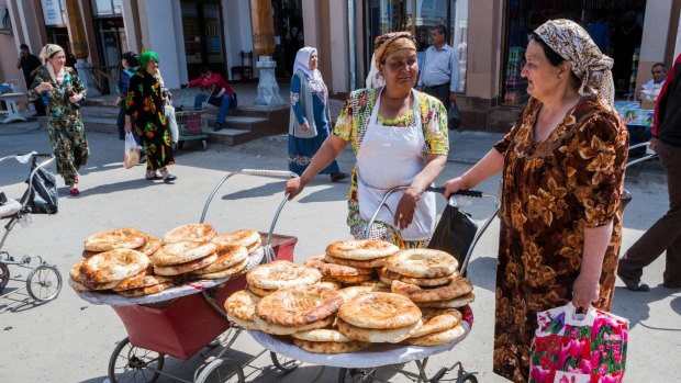 Samarkand is a bustling and modern city where ethnic Tajiks wear brightly coloured traditional clothes.