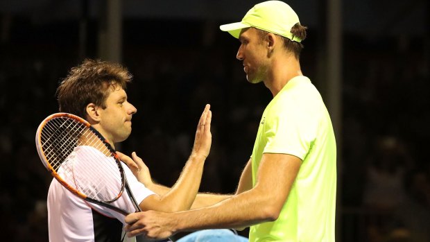 Karlovic and Zeballos embrace at the end of their marathon match. 