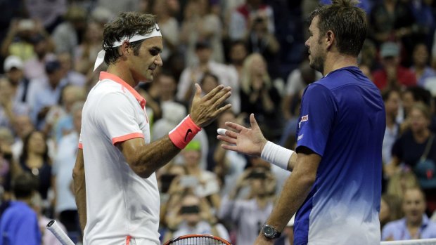All over: Roger Federer and Stan Wawrinka after their semi.