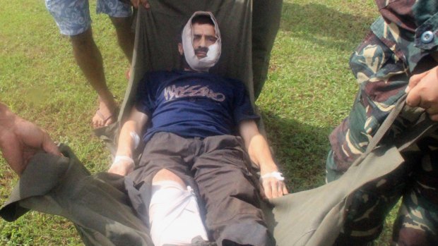 Swiss hostage Lorenzo Vinciguerra, is rushed to a hospital following his escape from the hands of the Muslim Abu Sayyaf extremists, in Jolo in southern Philippines on December 2014.