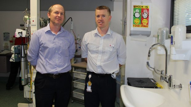 Associate Professor Sebastiaan van Hal (left) and Simon Burke, nursing unit manager of Royal Prince Alfred's Neonatal Intensive Care Unit, next to one of the sinks that was redesigned following an outbreak of a superbug.