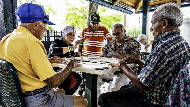 Locals playing a board game in Little Havana, Miami.