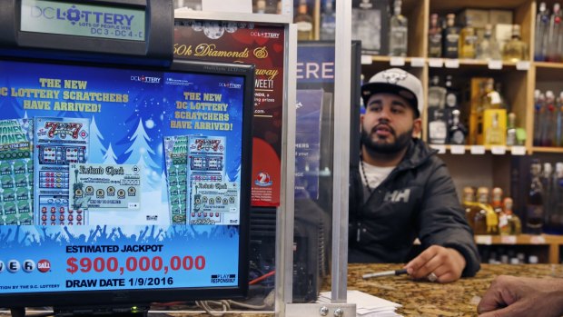 The massive jackpot total flashes on a screen at a lottery outlet in Washington. The total winnings have since increased to $US1.5 billion.