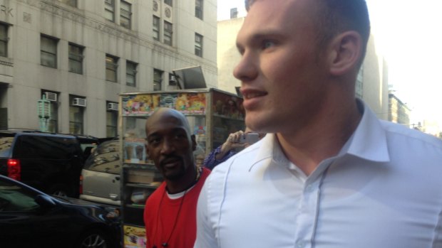 Matthew Lodge is questioned by a bystander in New York after leaving court.