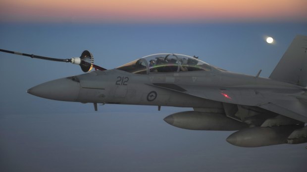 Service queried: A RAAF F/A-18F Super Hornet receives fuel from a RAAF tanker in the skies over Iraq.