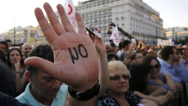 A demonstrator with the word "No" written on the palm of his hand during an anti-austerity rally in Athens.