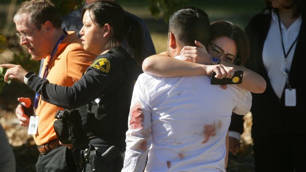 A couple embrace following the San Bernardino shooting in early December.