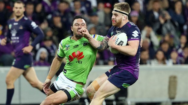 Tough win: Cameron Munster is challenged by Jordan Rapana on Saturday night.