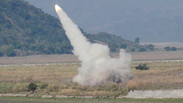 A US-made rocket system fires in Crow Valley, Philippines. US and the Philippines, which is locked in a dispute with China over part of the South China Sea, conduct annual joint military exercises.