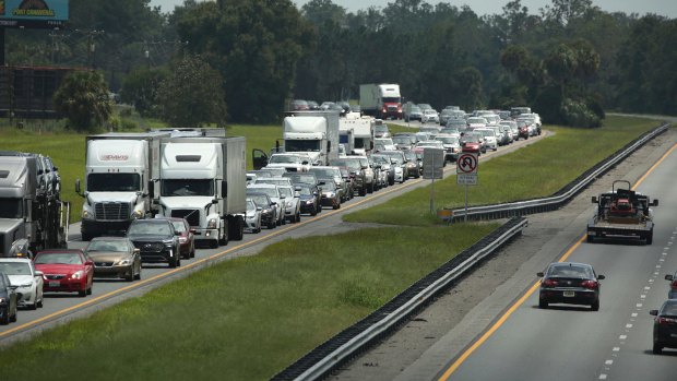Traffic rolls at a crawl along the northbound lanes of a highway in Wildwood, Florida on Friday.