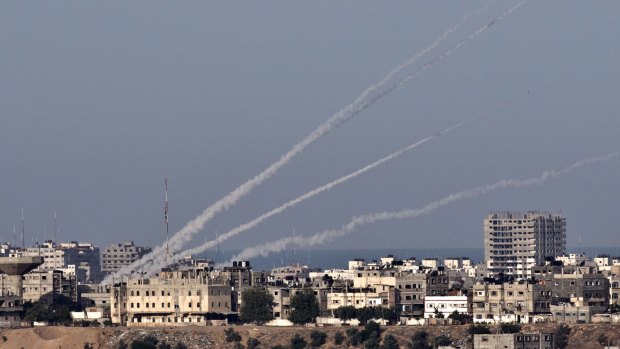 Attacks labelled war crimes: A picture taken from the southern Israeli city of Sderot shows four rockets being launched from the Gaza Strip into Israel on November 16, 2012.