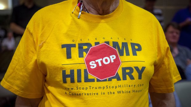 A conservative voter shows off a T-shirt he picked up at the Republican State Convention during a campaign stop by Evan McMullin.