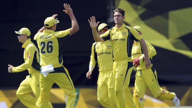 Million dollar man: Mitchell Marsh (right) played a leading hand in Australia's win over the Black Caps in Wellington.