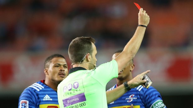 Major moment: Referee Mike Fraser holds the red card to dismiss Stormers winger Leolin Zas.