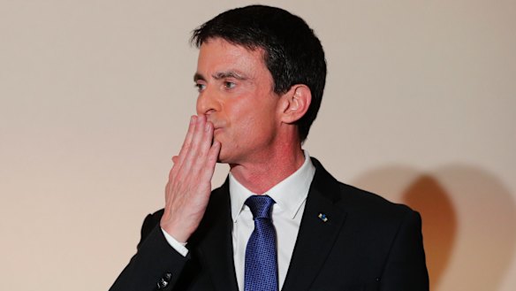 Former socialist Prime Minister Manuel Valls blows a kiss to supporters after conceding defeat.