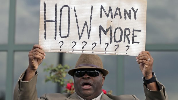 A protester holds a sign after the shooting death of Walter Scott in South Carolina in April.