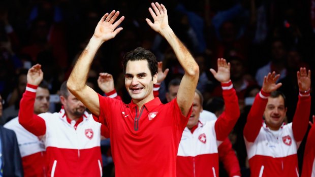 Roger Federer, of Switzerland, leads the celebrations after defeating Frenchman Richard Gasquet       in the Davis Cup final at the Stade Pierre Mauroy in Lille, France.   