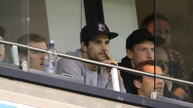 Richmond captain Trent Cotchin watches the VFL grand final with teammates.