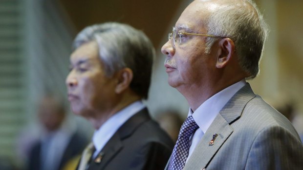 Malaysian Prime Minister Najib Razak, right, with Deputy Prime Minister Ahmad Zahid Hamidi, stands for the national anthem on Thursday.