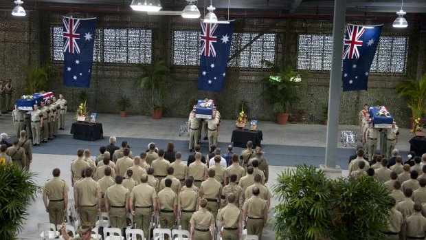 The coffins of Australian soldiers Lance Corporal Rick Milosevic, Sapper James Martin and Private Robert Poate at a repatriation ceremony in RAAF Base Amberley on September 5, 2012. 