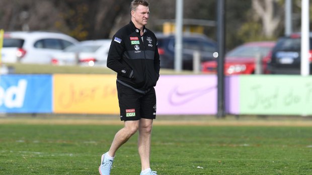 Nathan Buckley takes some time out at Collingwood training on Monday.