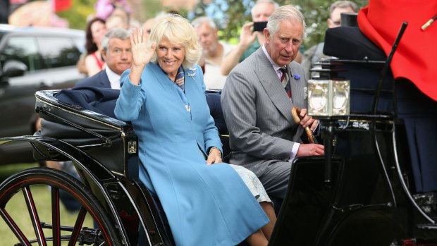 Camilla, Duchess of Cornwall and Prince Charles, Prince of Wales in the royal carriage as they visit Sandringham Flower Show on July 29, England.