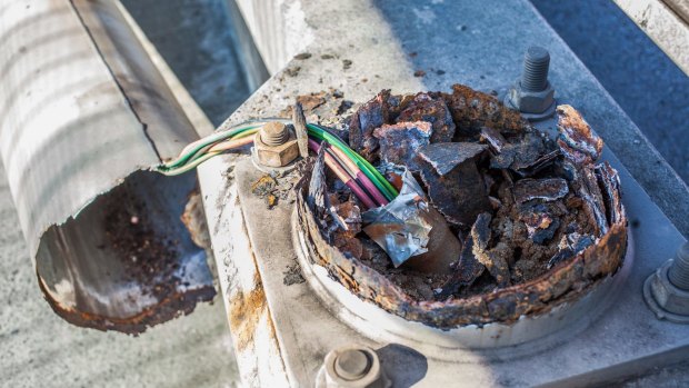 The base of a lighting tower which toppled on the Anzac Bridge on Monday.