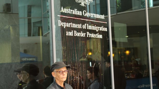 Fake blood was spattered at the Immigration Department building in Brisbane.