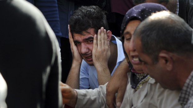 Relatives of people wounded in Ankara await news of their loved ones at a hospital on Saturday.