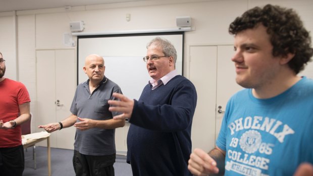 Arts reporter Ron Cerabona, second from right, participates in a word association exercise at the National Acting School in Dickson.