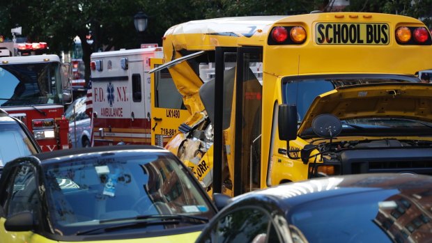 Authorities respond near a damaged school bus.