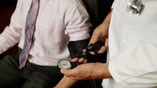 bloodpressure.jpg Doctor. Generic set up photo of a doctor taking a businessmans blood pressure. 5 June 2006. AFR Photo by Andrew Quilty. Generic doctor, health, blood pressure, businessman. SPECIALX 52319 no
