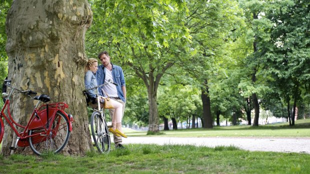 Green space: Cyclists take a break at a park in Berlin.
