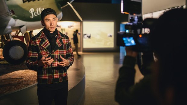Singapore star Desmond Tan visiting the Australian War Memorial to record a travel show for screening in his homeland.