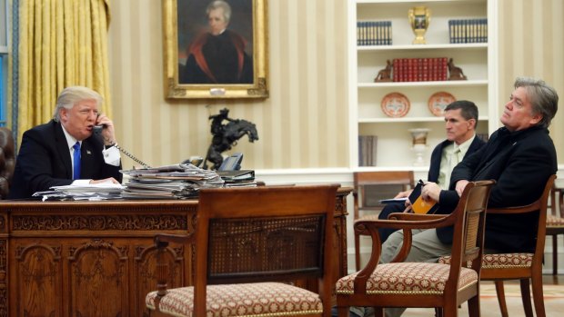 President Donald Trump with Mike Flynn (centre) and Steve Bannon (right) in the Oval Office during the call to Prime Minister Malcolm Turnbull.