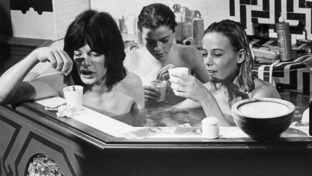 Mick Jagger enjoys a bath with Michele Breton and Anita Pallenberg in the film Performance.