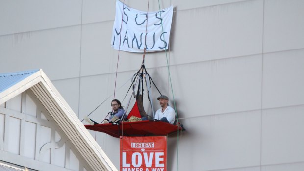 The protesters suspended above Julie Bishop's Perth office. 