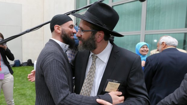 Sheikh Wesam Charkawi and Rabbi Zalman Kastel greet each other at the event.