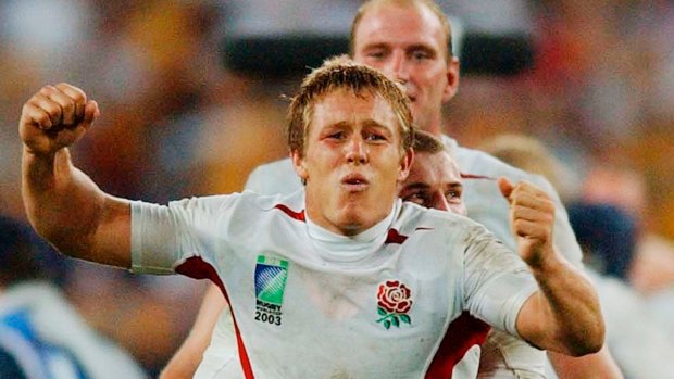 England's glory: Jonny Wilkinson, left, is grabbed by teammate Ben Cohen as they celebrate their Rugby World Cup win over Australia in 2003.