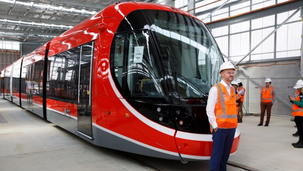 The NSW government will look at extending Canberra's light rail to Queanbeyan. Pictured is ACT chief minister Andrew Barr with Canberra's first light rail vehicle.