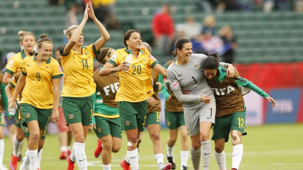 Matilda players (from left) Caitlin Foord, Alanna Kennedy Samantha Kerr, goalkeeper Lydia Williams and substitute Leena Khamis celebrate the 1-1 draw with Sweden in Edmonton, Canada, which saw them secure a match against Brazil in the final 16 of the Women's World Cup.